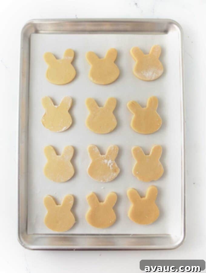 cookie sheet of unbaked bunny face cookies