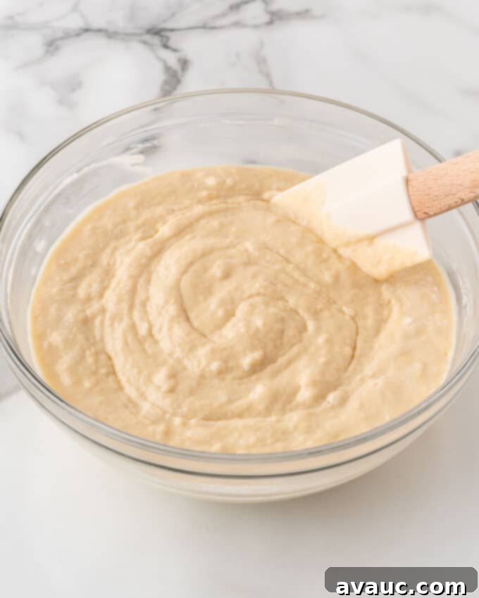 crispy waffle batter in a mixing bowl, showing its thick and lumpy consistency