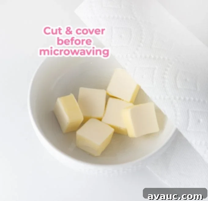 Decadent Chewy Snickers Cookies 4 Bowl of butter cut into cubes and covered with paper towel for microwave melting