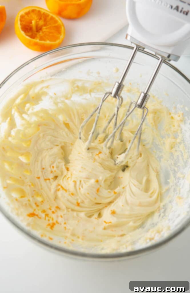One-Hour Citrus Cinnamon Buns 16 Bowl of orange cream cheese frosting for cinnamon rolls