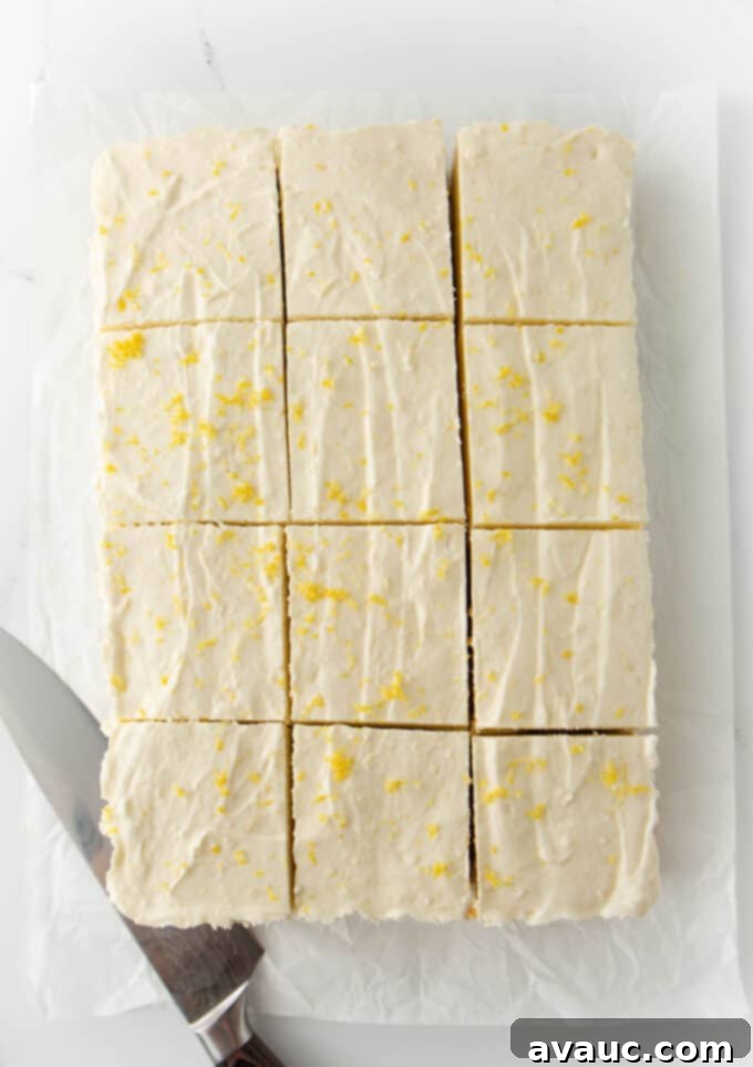 Easy No Bake Lemon Cheesecake Squares 13 9x13 pan of no bake lemon cheesecake bars cut into 13 squares
