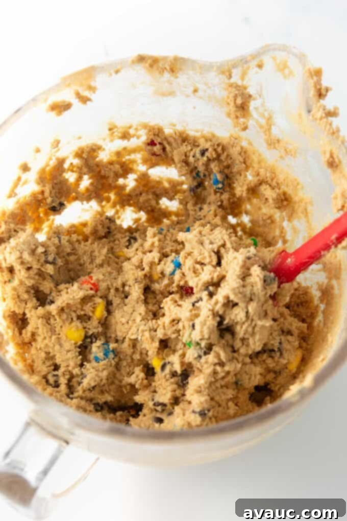 Kitchen Sink Cookie Bars 5 monster cookie bar dough in glass bowl