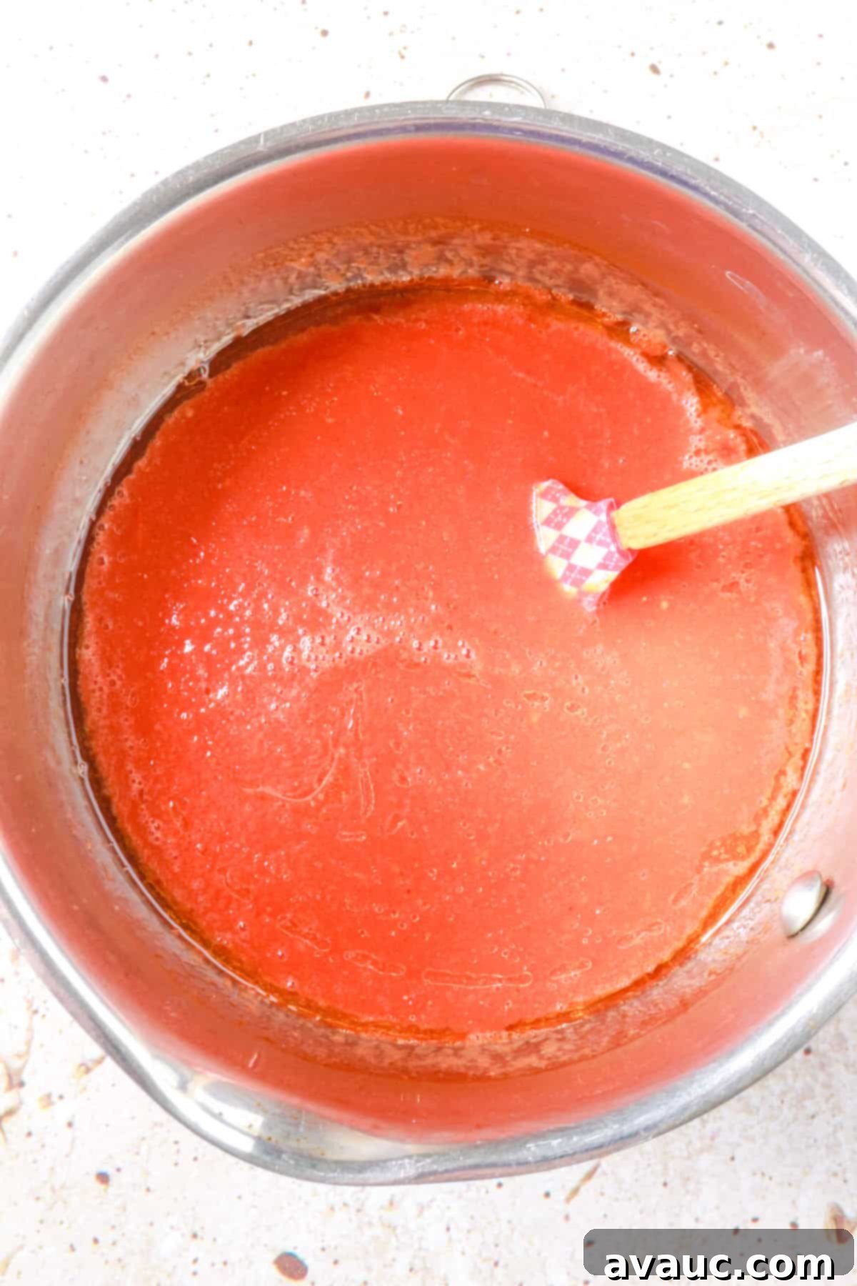 tomato sauce simmering in a saucepan