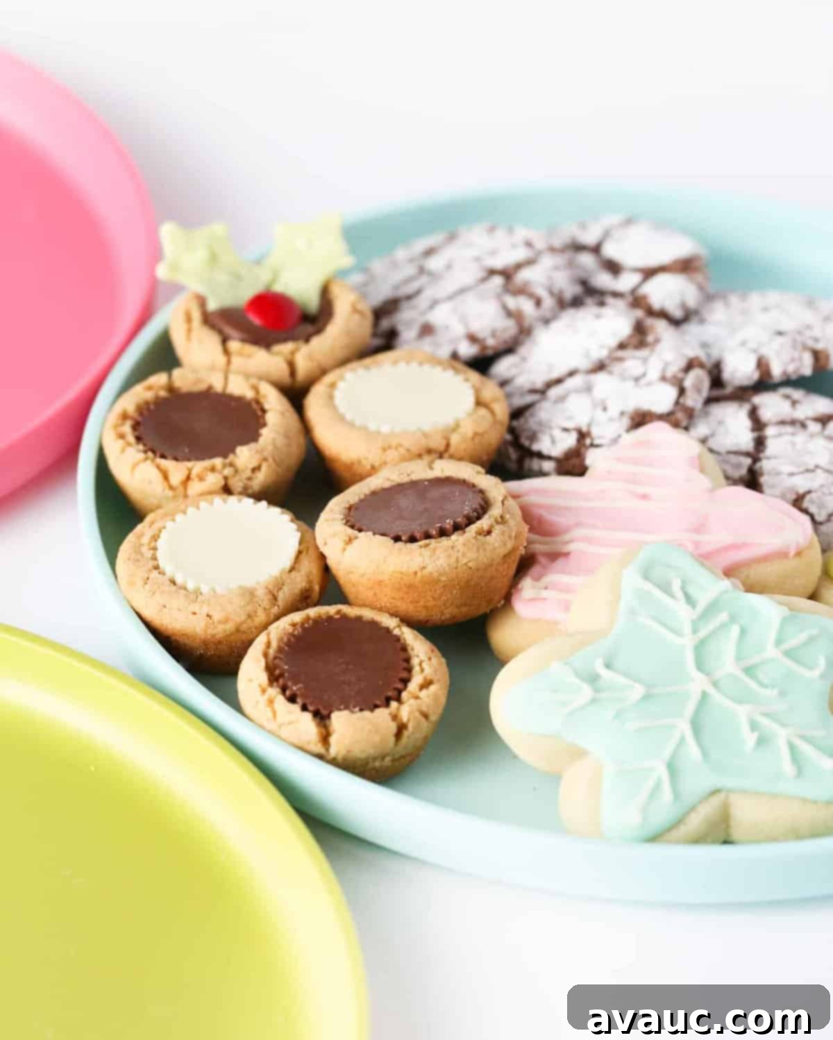 Assortment of homemade chocolate brownie cookies, including some with a crackle top, artfully arranged for gifting or display.