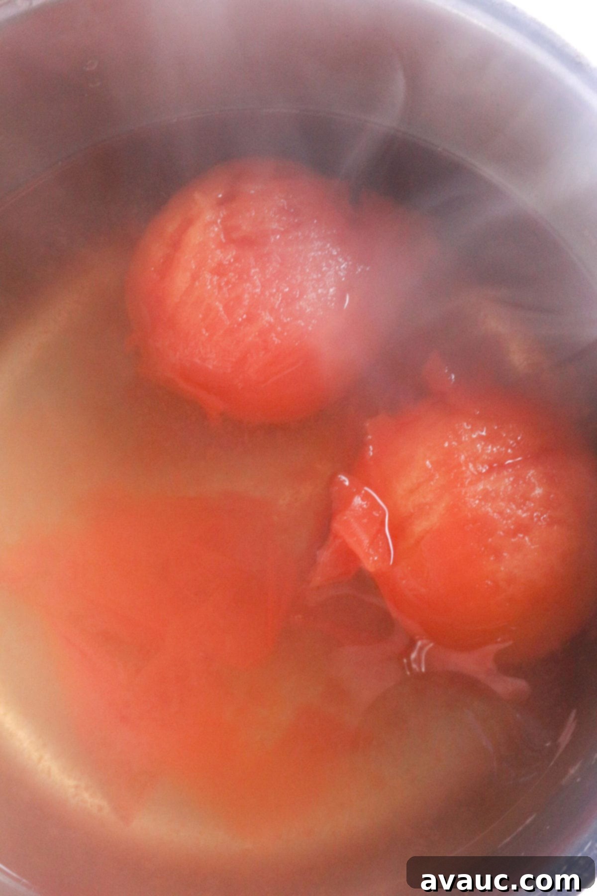 Tomatoes boiling in water