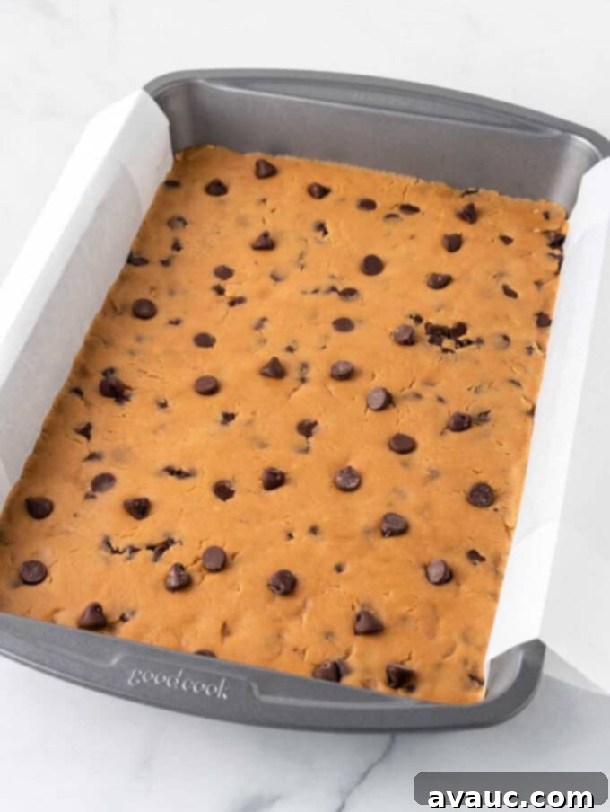 Chewy Peanut Butter Cookie Bars 7 peanut butter chocolate chip cookie dough in pan