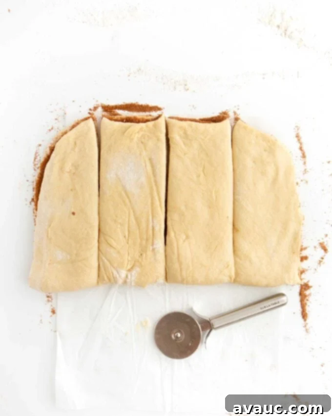 Effortless Cinnamon Swirl Knots 13 cinnamon roll dough cut in four pieces