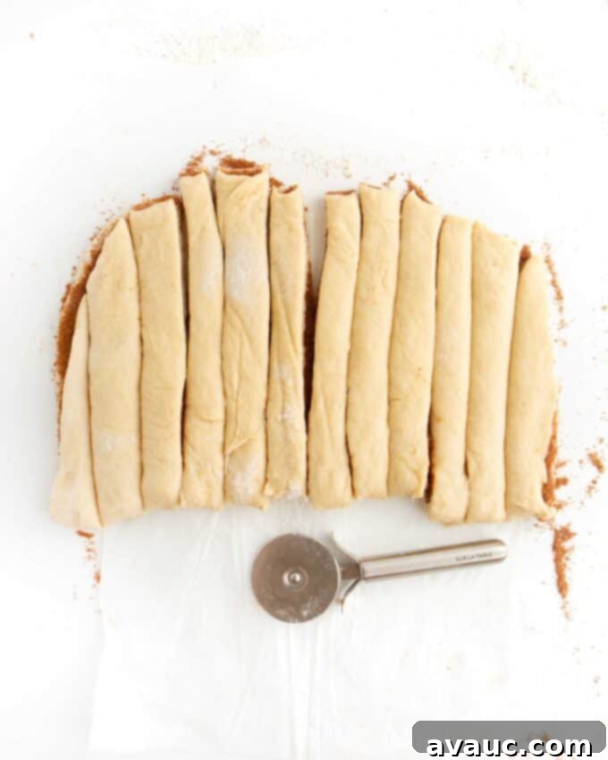 Effortless Cinnamon Swirl Knots 14 cinnamon roll dough cut into strips