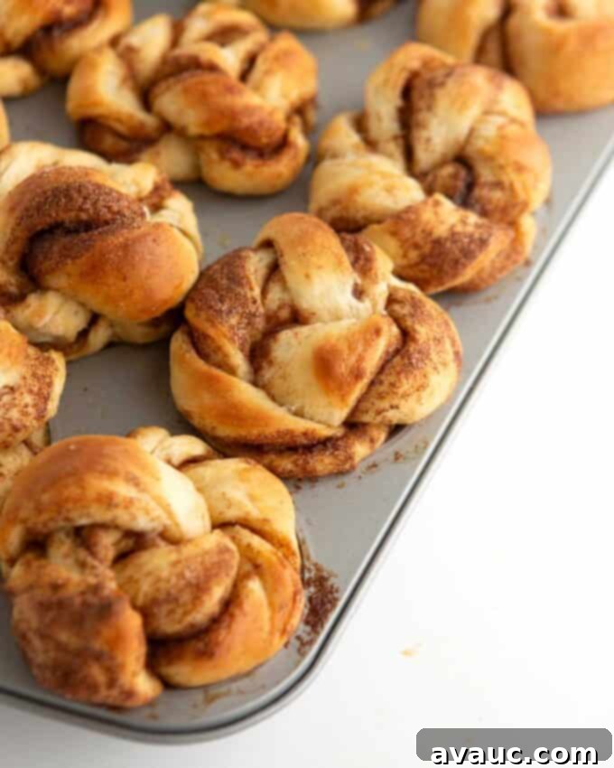 Effortless Cinnamon Swirl Knots 3 unbaked cinnamon roll muffin dough brushed with milk