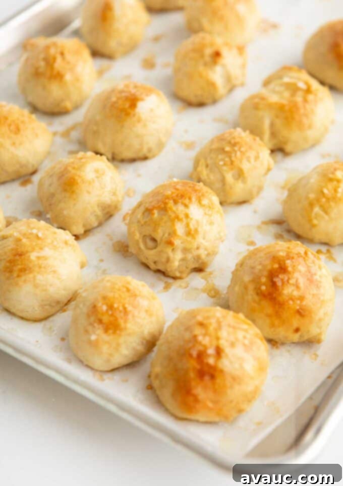 Effortless Soft Pretzel Bites 11 baked pretzel balls on baking tray