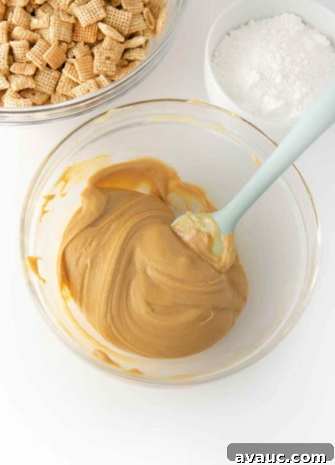 Melting white chocolate, peanut butter, and butter in a bowl