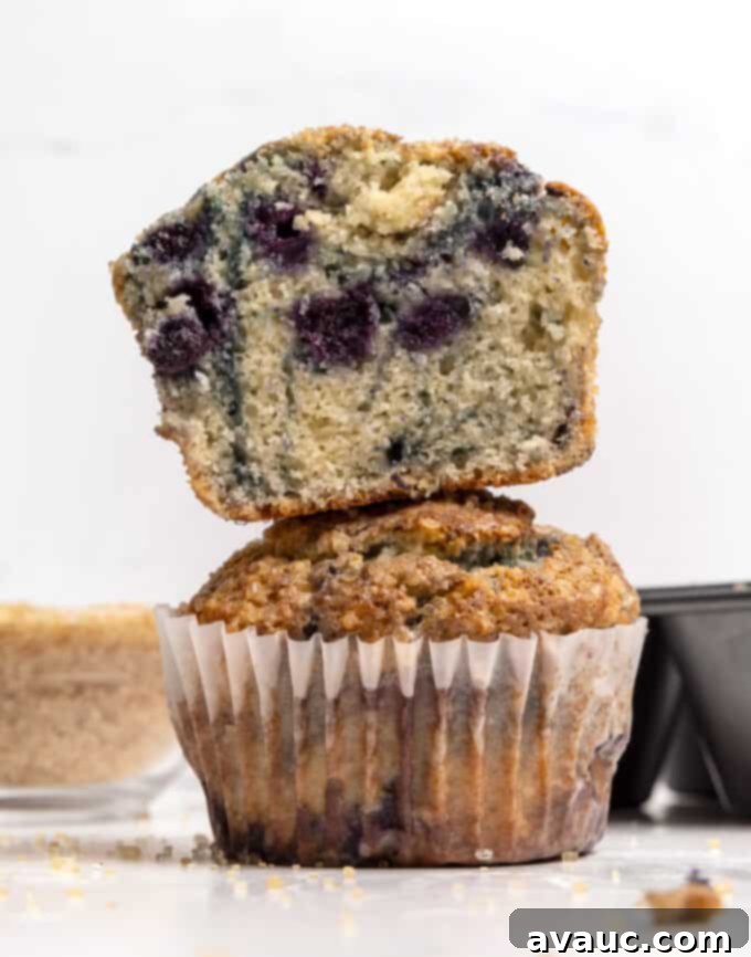 Stack of jumbo blueberry muffins, showcasing their generous size and golden tops.