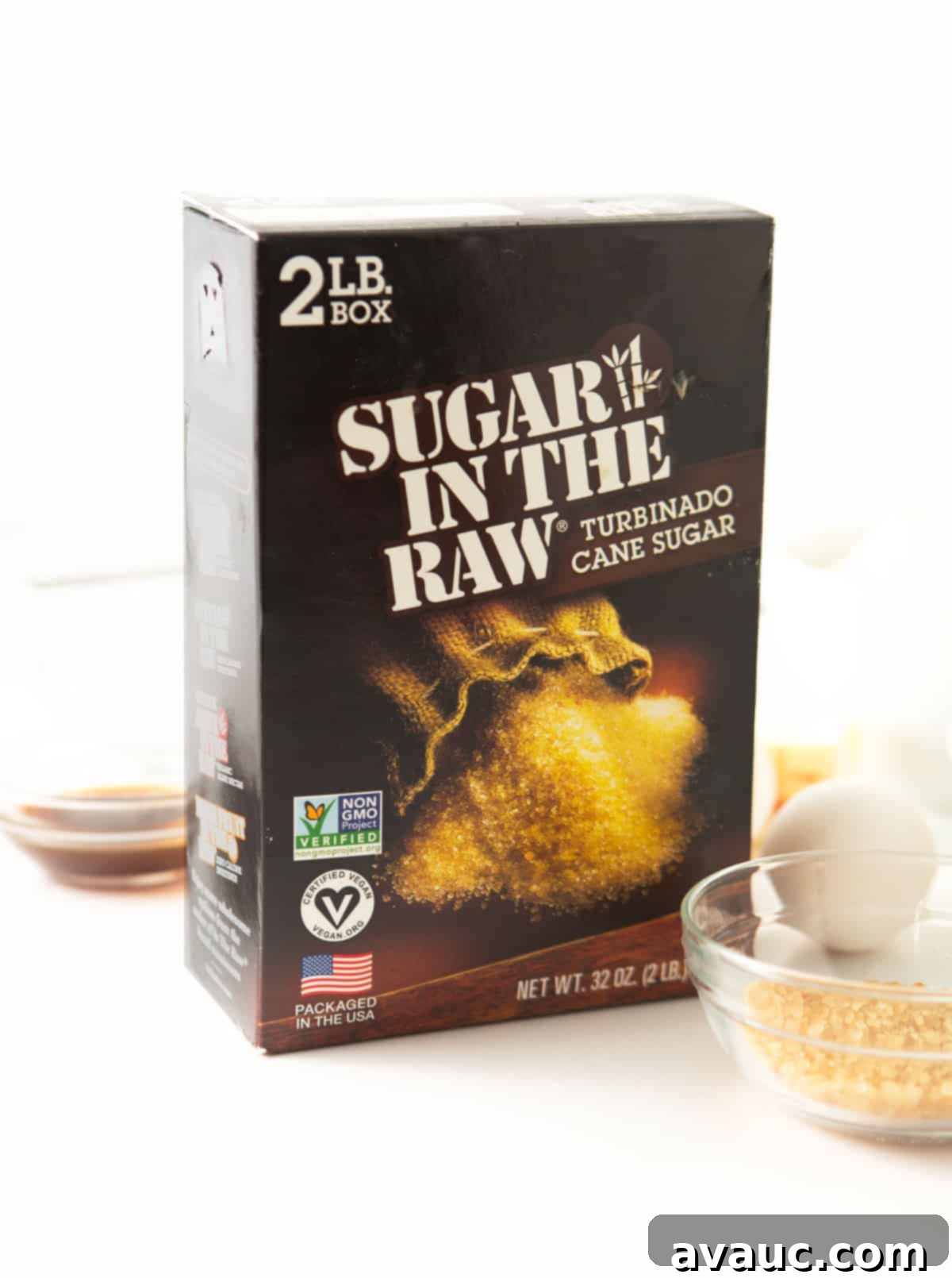 Box of Sugar In The Raw turbinado cane sugar, showing its coarse crystals.