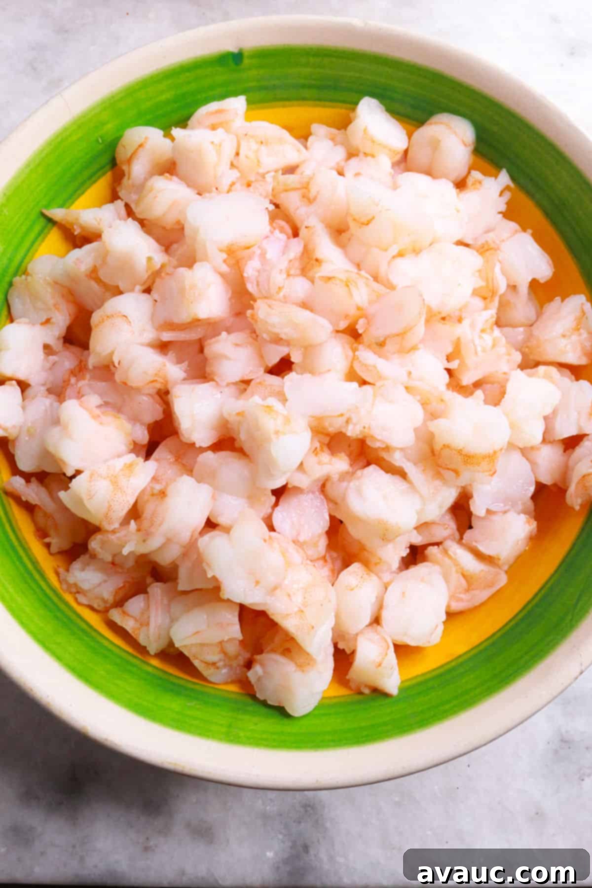 Vibrant Mexican Shrimp Cocktail 6 Bowl with cooked shrimp cut into pieces, ready for the cocktail.