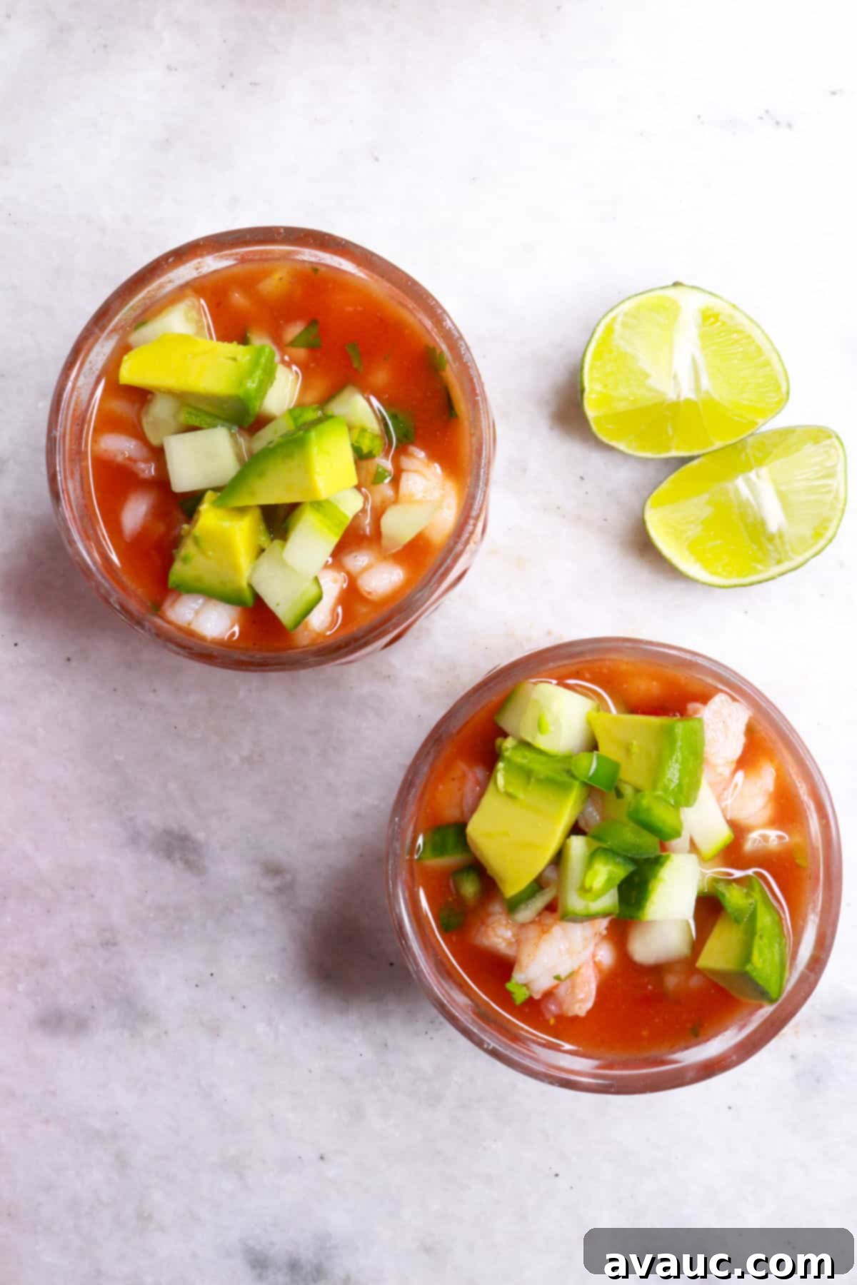 Vibrant Mexican Shrimp Cocktail 9 Top view of two individual glasses filled with vibrant Mexican shrimp cocktail, ready to be served.