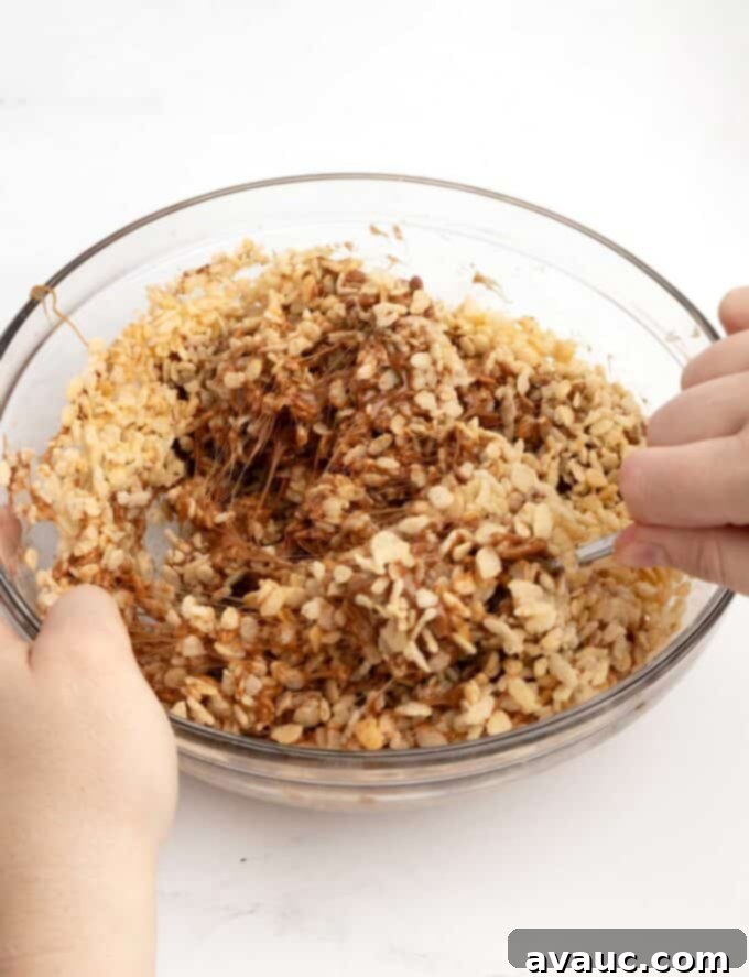 Spiced Gingerbread Krispie Treats 12 A large bowl of the star crunch rice krispy mixture, with crispy cereal evenly coated in chocolate caramel