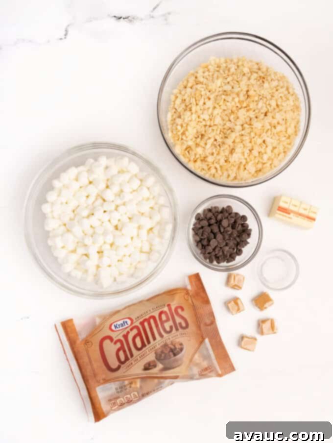 Spiced Gingerbread Krispie Treats 4 A vibrant flat lay of mini gingerbread star crunch rice krispy bar ingredients, including caramels, chocolate chips, marshmallows, and crispy rice cereal
