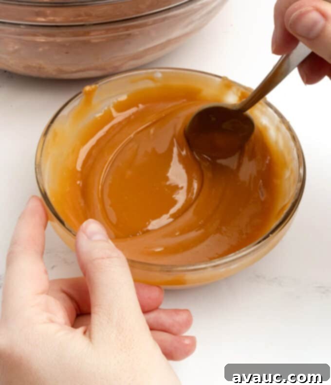 Spiced Gingerbread Krispie Treats 6 A close-up of a bowl of perfectly melted Kraft caramels, smooth and golden brown