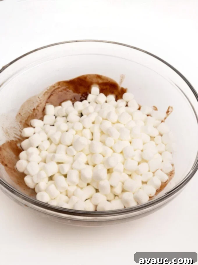 Spiced Gingerbread Krispie Treats 8 A bowl of melted chocolate with mini marshmallows added, ready for heating