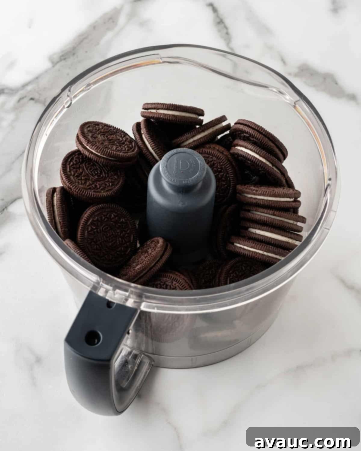 No-Dip Oreo Truffles 5 Whole Oreo cookies being processed into fine crumbs in a food processor.