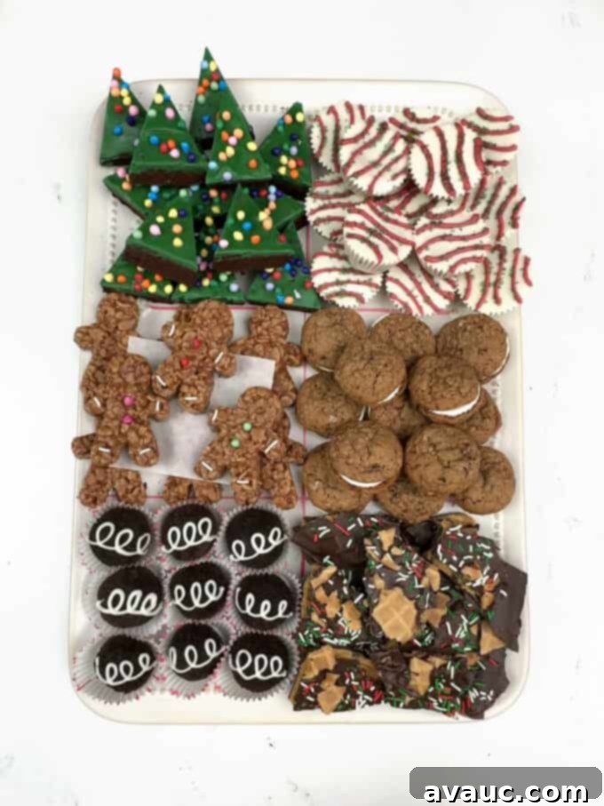 Little Debbie Festive Treats Collection 2 A festive holiday tray featuring six different homemade Little Debbie inspired treats: Christmas Tree Brownies, Cake Bite Cups, Gingerbread Rice Krispie Treats, Oatmeal Creme Pies, Oreo Truffles, and Nutty Buddy Bark, all arranged for a holiday party.