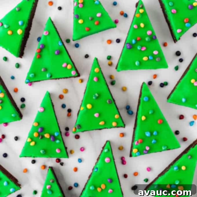 Little Debbie Festive Treats Collection 3 Fudgy Christmas tree shaped brownies with colorful sprinkles on top, inspired by Little Debbie Cosmic Brownies.