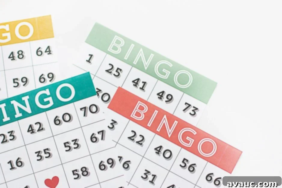 Ready to Print Bingo Fun 6 A hand reaching into a bowl filled with small, cut-out paper numbers for a DIY bingo game.