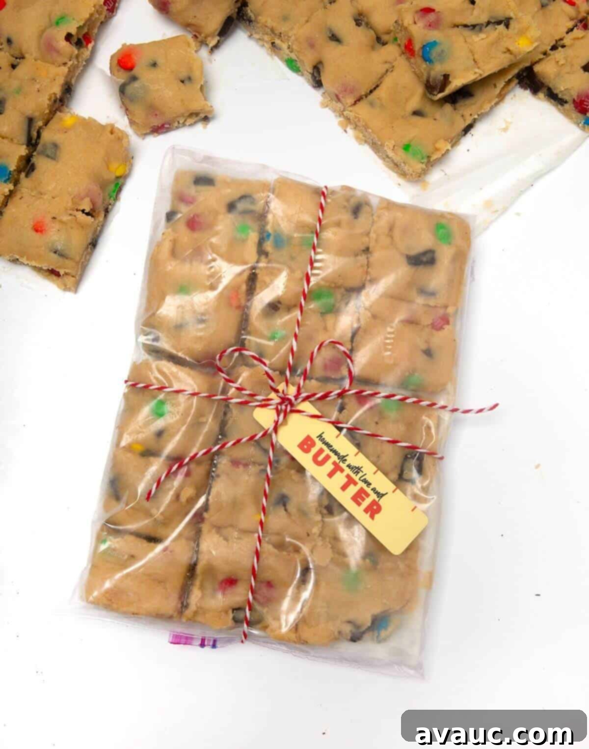 Beautifully wrapped frozen cookie dough squares with a decorative gift tag, ready to be presented to a friend.