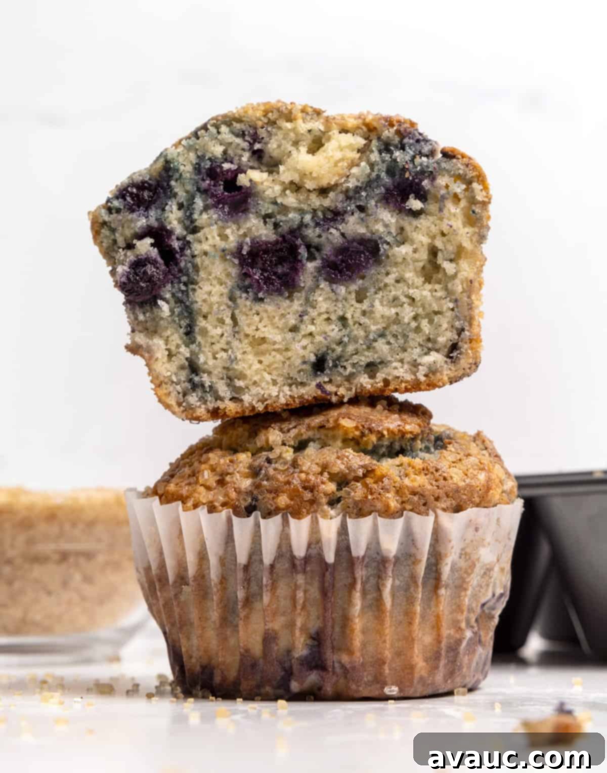 Whip Up Your Own Muffin Mix 4 A stack of golden-brown jumbo blueberry muffins, showcasing a perfectly domed top.