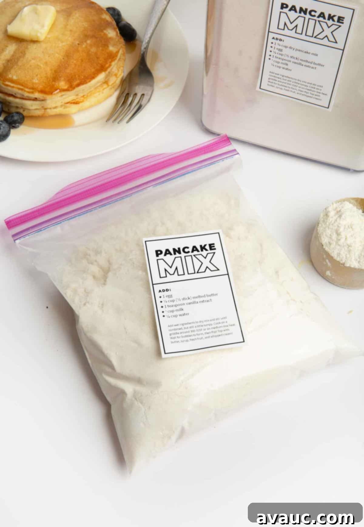 bag of homemade pancake mix on a wooden surface with a measuring cup