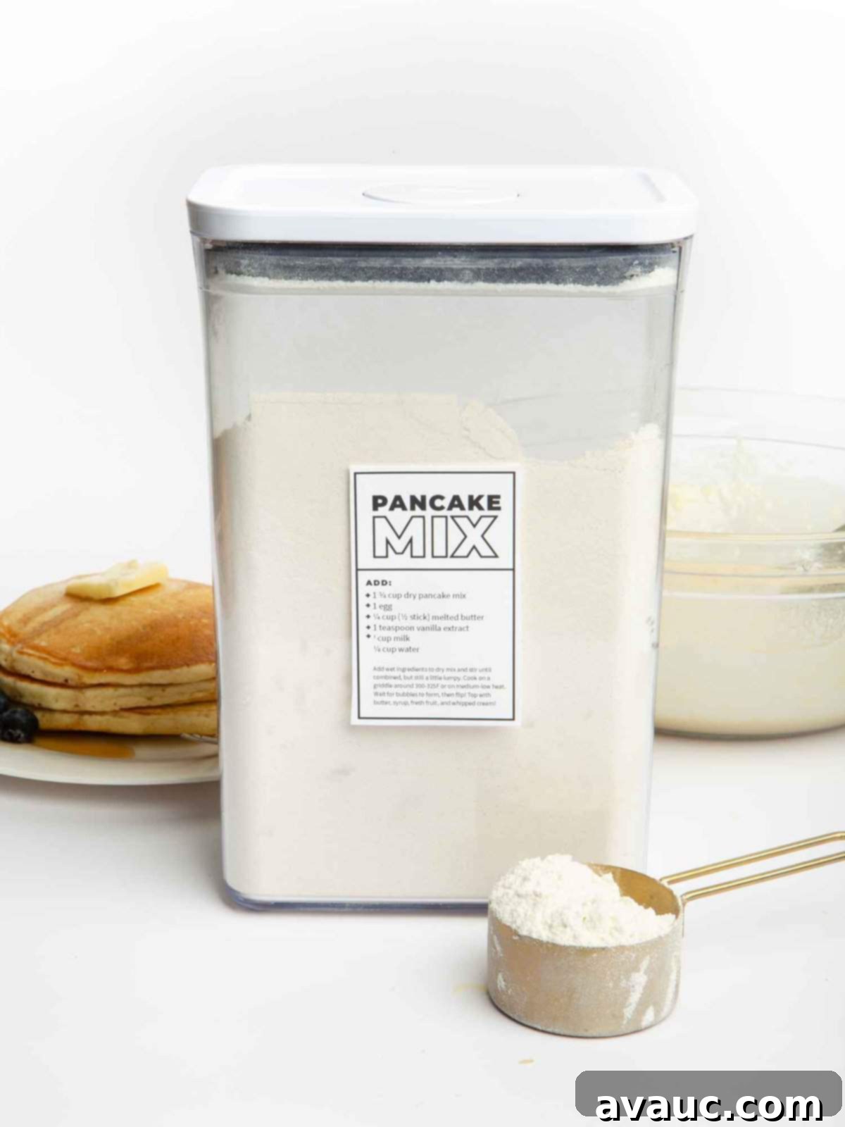 container of homemade pancake mix with a scoop