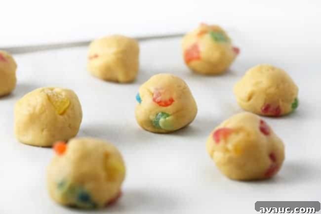 Balls of dough on cookie sheet for sour patch kids cookies