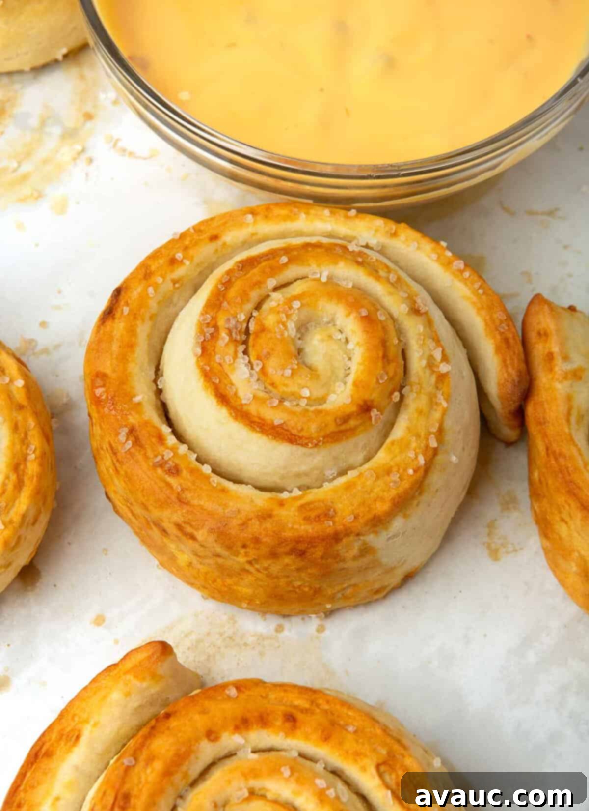 Effortless Soft Pretzel Rolls 2 Swirled soft pretzel roll with coarse salt on top, ready to be enjoyed.