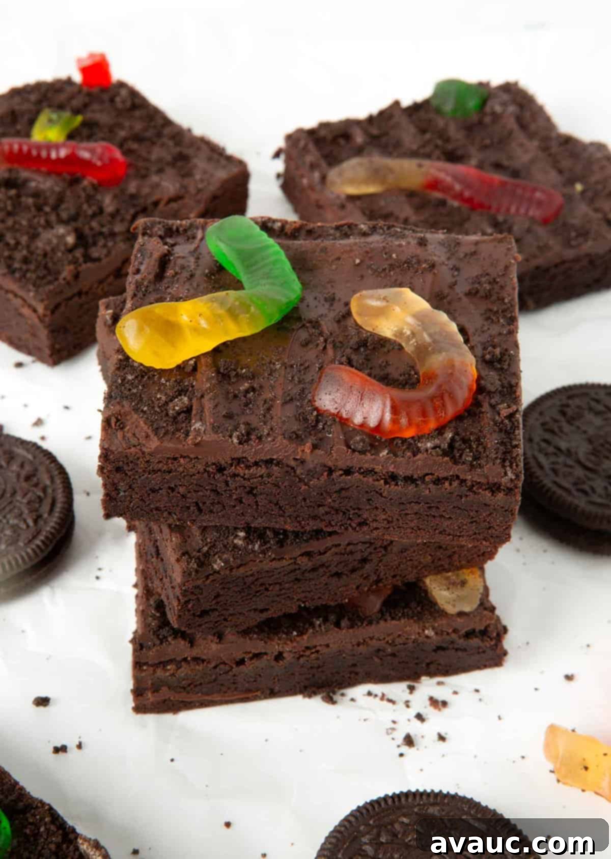 No-Fuss Dirt Cookie Bars 2 Close-up of fudgy OREO dirt cookie bars with gummy worms in a baking pan