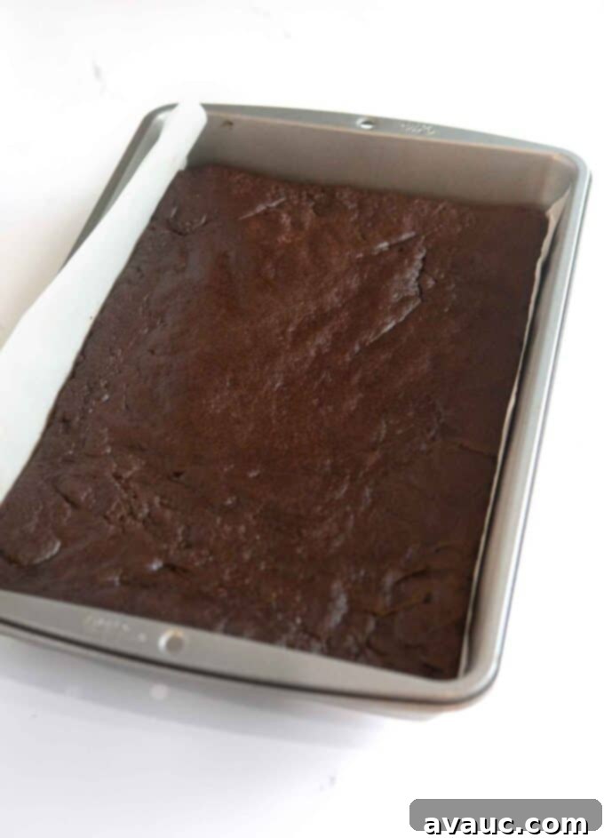 No-Fuss Dirt Cookie Bars 8 Baked chocolate cookie dough cooling in a 9x13 metal pan