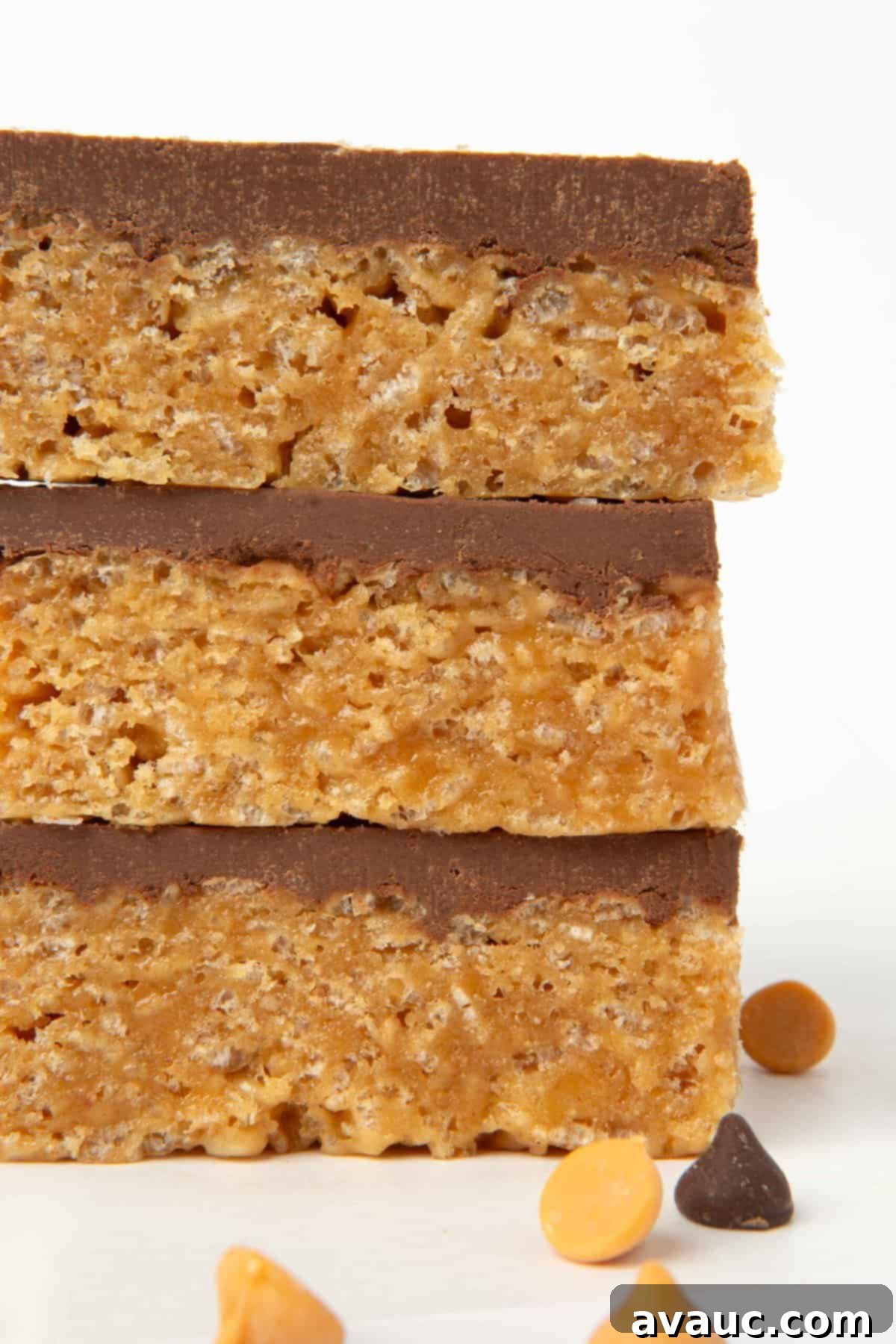 stack of scotcheroo bars, showcasing their thick, chewy texture and generous topping of chocolate and butterscotch