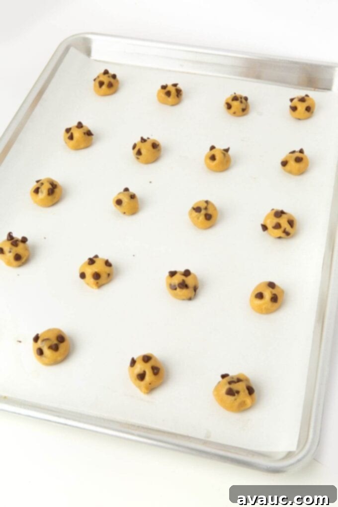 Bite-Sized Chocolate Chip Cookies 7 cookie dough balls on baking sheet