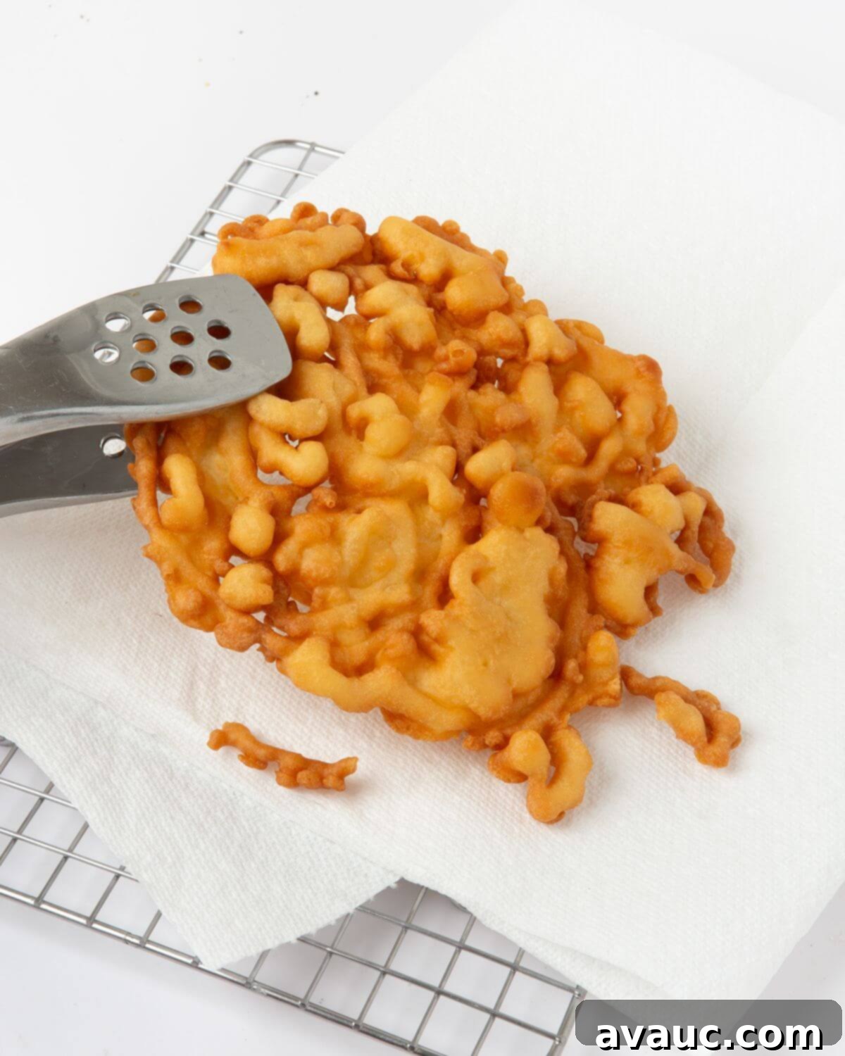 Simple Homemade Funnel Cakes 3 fried funnel cake on paper towel