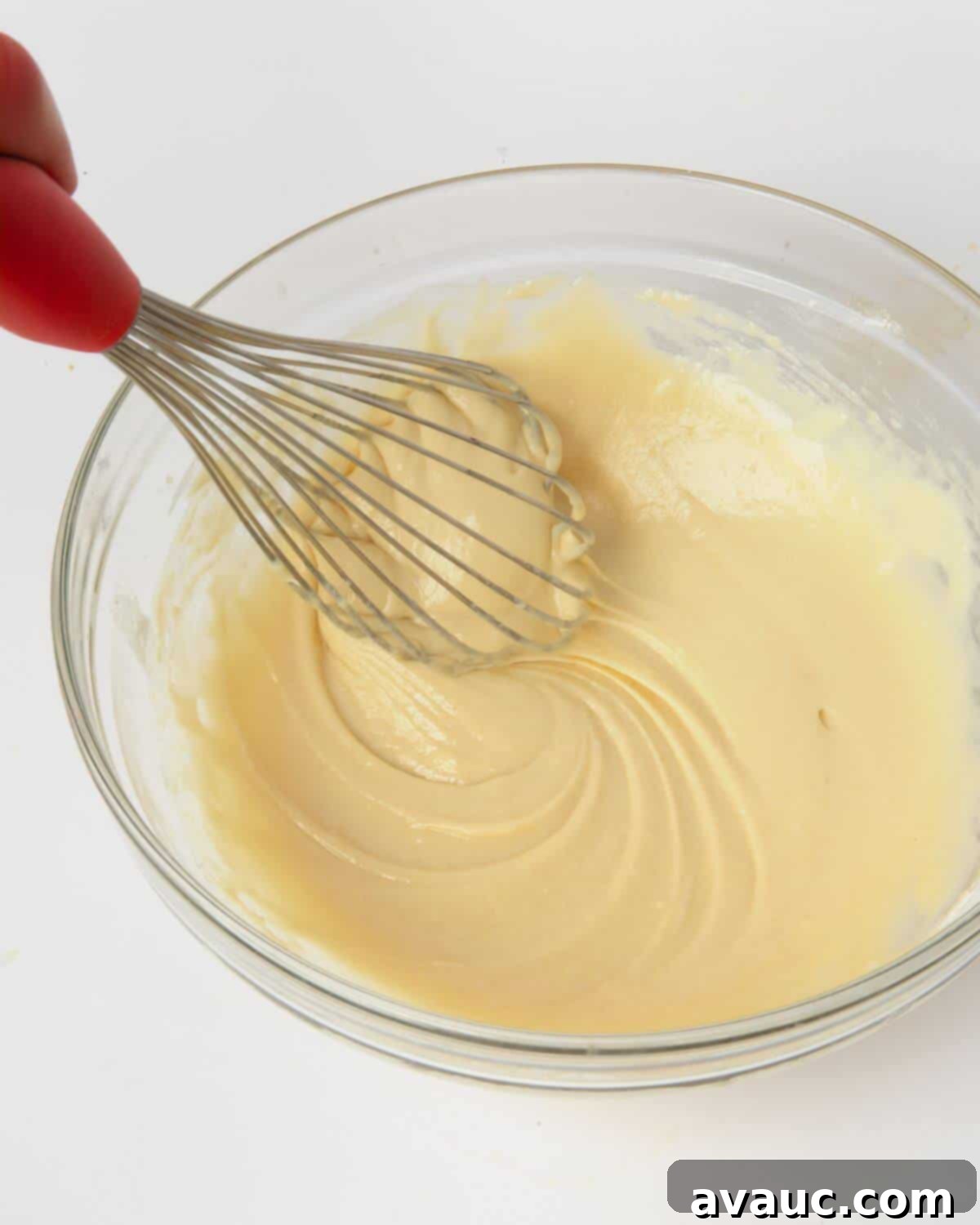 Simple Homemade Funnel Cakes 5 funnel cake batter in mixing bowl with whisk
