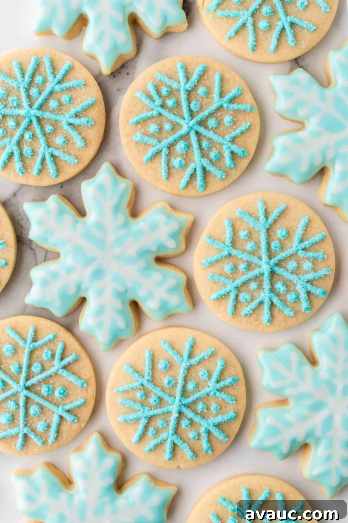 Beautifully frosted snowflake sugar cookies arranged for a festive display