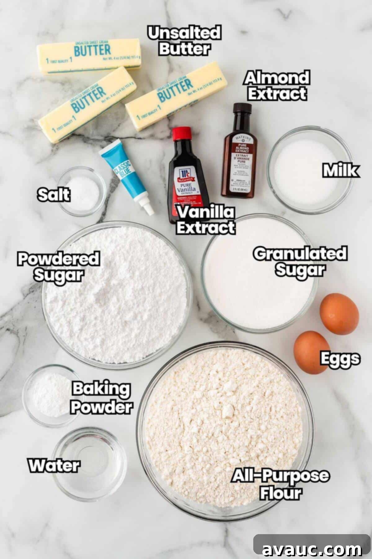 Key ingredients for making snowflake sugar cookies laid out on a kitchen counter