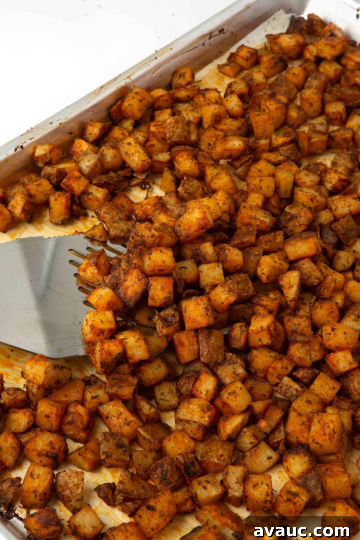 oven roasted breakfast potatoes on sheet pan with parchment paper
