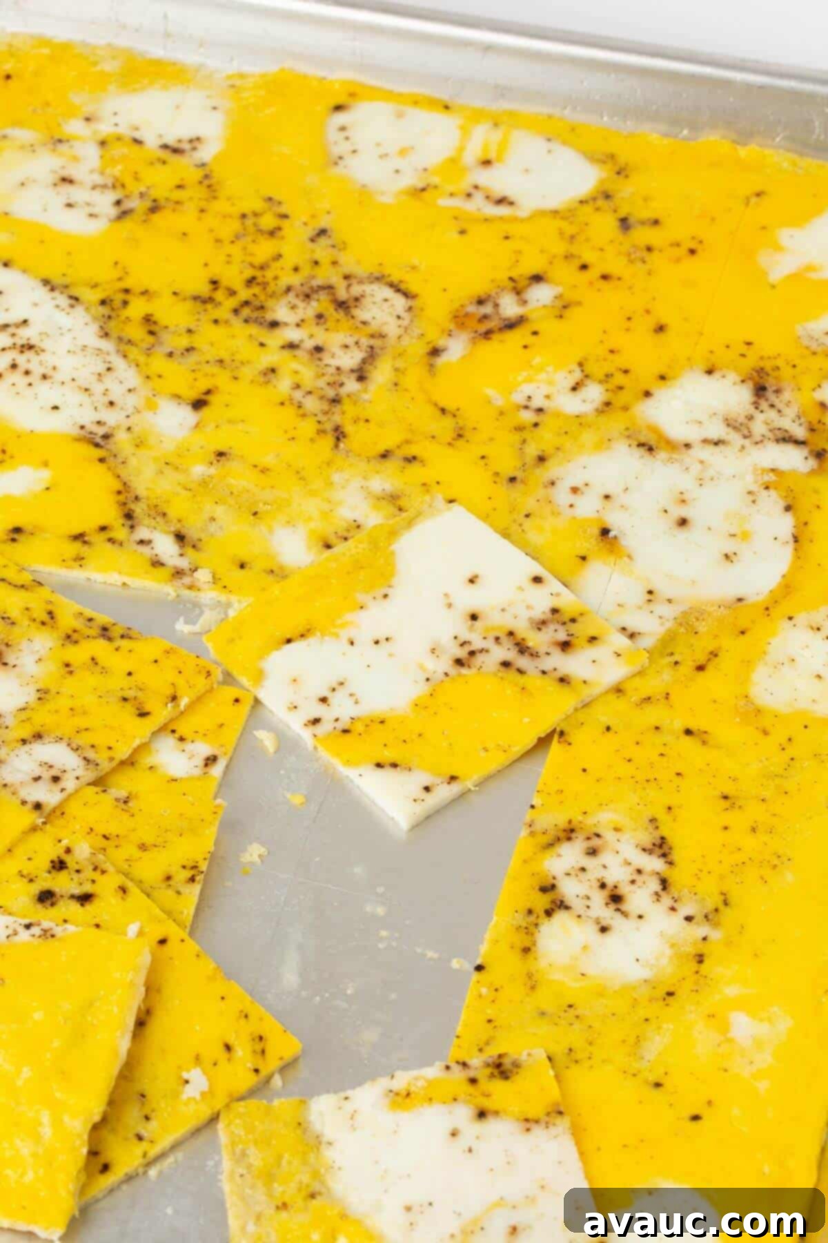 sheet pan eggs cut into squares on rimmed baking sheet