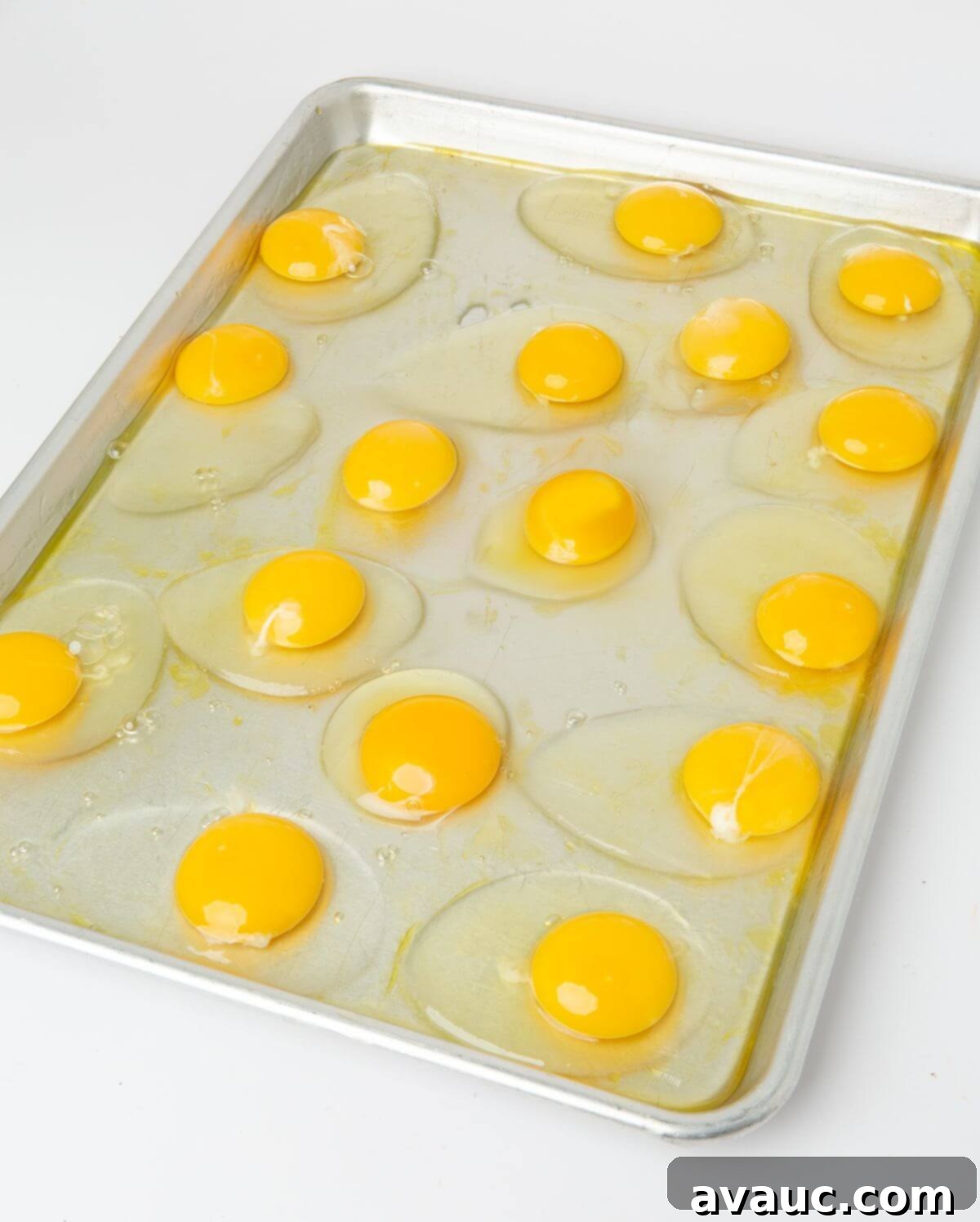 16 large eggs cracked on half sheet pan