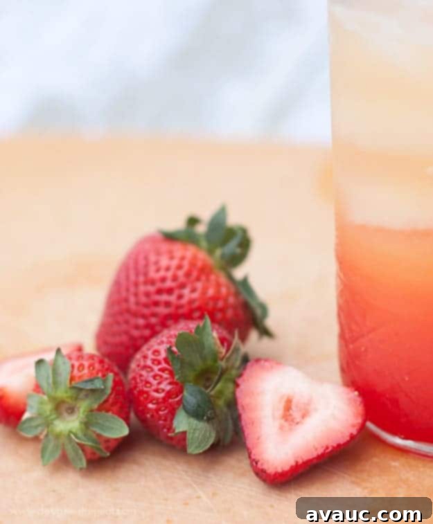 Easy Non-Alcoholic Summer Spritzer Recipe with Orange Juice, Lemon-Lime Soda, and Grenadine – so simple to make! Design Eat Repeat