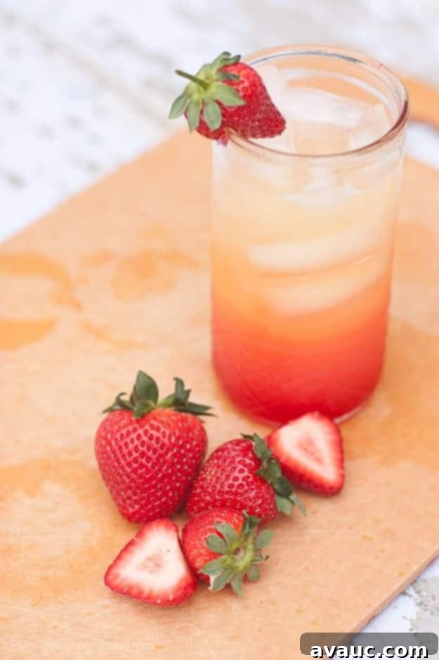 Refreshing Summer Spritzer made with Orange Juice, Lemon-Lime Soda, and Grenadine - so easy to make and perfect for hot days! Design Eat Repeat