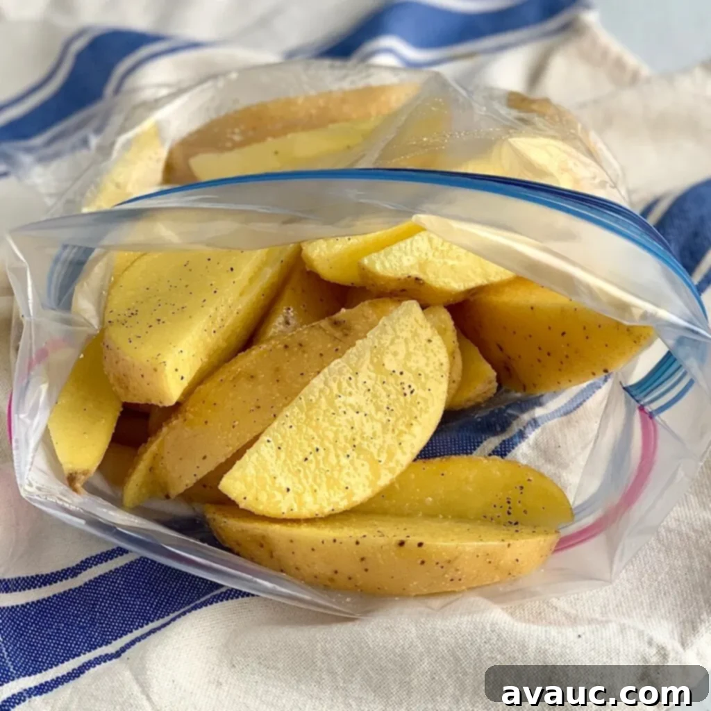Golden Crispy Potato Wedges 5 Potato wedges in a Ziploc bag with seasonings and oil