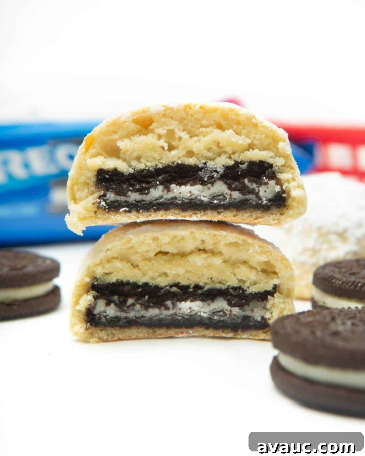 Ultimate Air Fried Oreos 2 Two air fried Oreos, cut in half and stacked, showing the fluffy batter and cookie inside.