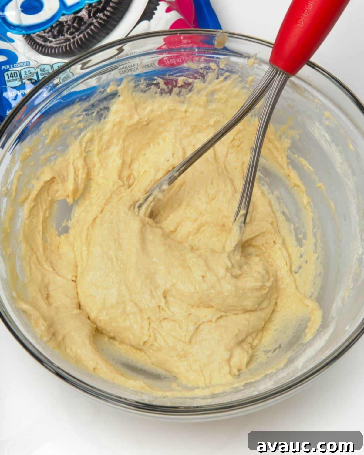 Ultimate Air Fried Oreos 6 Smooth air fried Oreo batter in a glass bowl with a whisk.