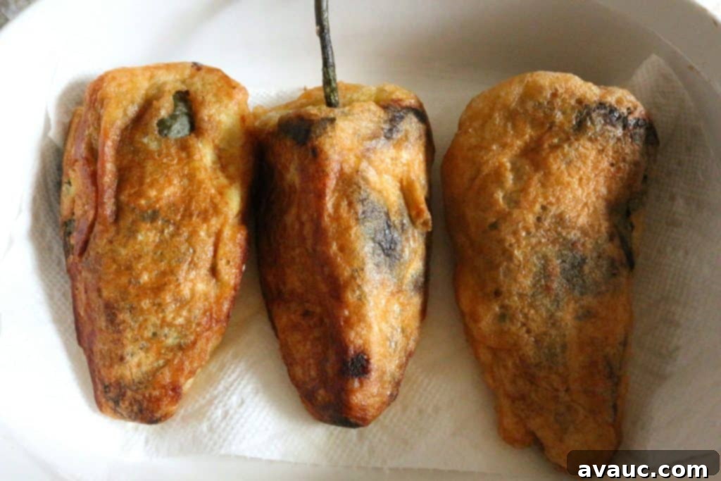 Golden fried chiles rellenos ready to be served
